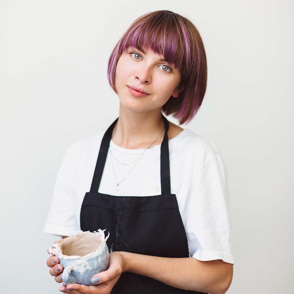 beautiful-girl-with-colorful-hair-in-black-apron-a-KP6Q84V.jpg