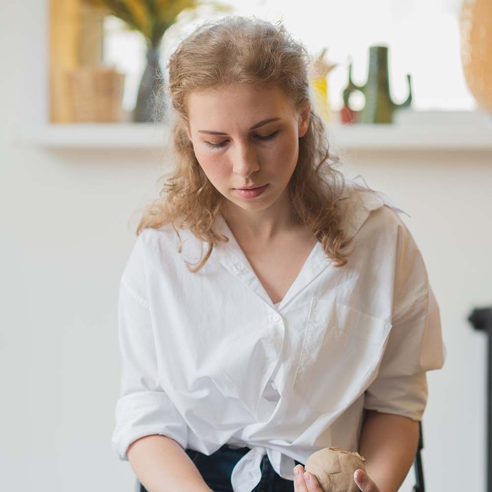 close-up-view-of-woman-hands-working-on-pottery-wh-EMBA7ZX.jpeg
